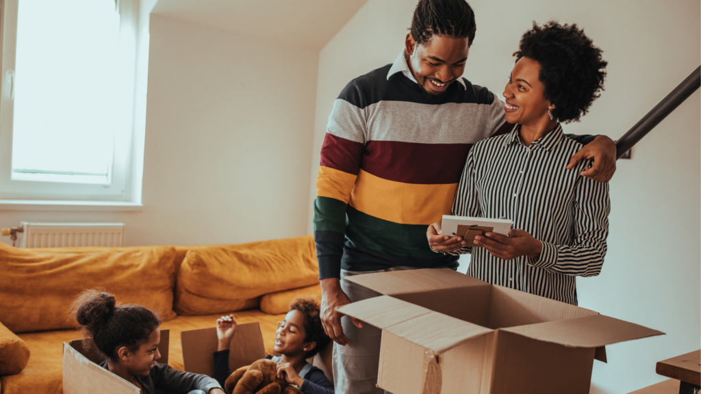 Family unpacking boxes