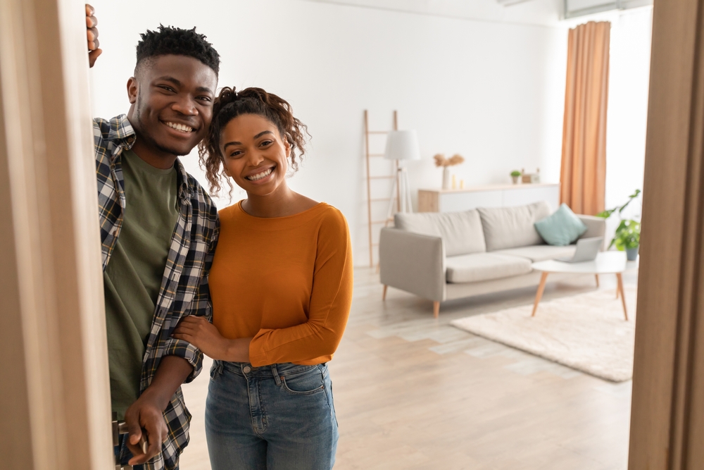 Smiling African American couple in their new home